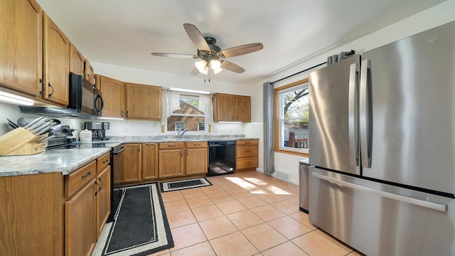 1008 Mary Ave, Dixon, IL 61021 - kitchen featuring black appliances, light countertops, ceiling fan, light tile patterned floors, and a sink