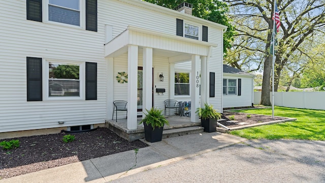 1008 Mary Ave, Dixon, IL 61021 - view of front of house with a porch, a chimney, and fence