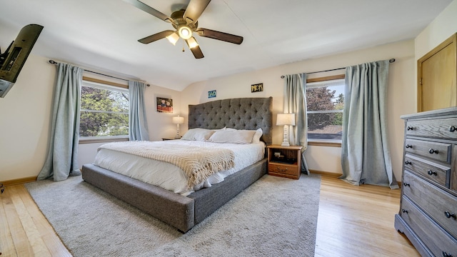 1008 Mary Ave, Dixon, IL 61021 - bedroom with light wood-style floors, baseboards, a ceiling fan, and vaulted ceiling