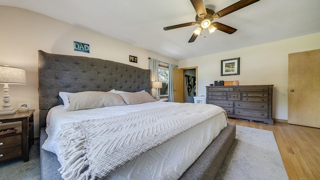 1008 Mary Ave, Dixon, IL 61021 - bedroom with wood finished floors, a ceiling fan, and a walk in closet
