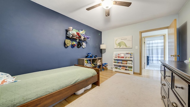 1008 Mary Ave, Dixon, IL 61021 - bedroom featuring light wood-type flooring, ceiling fan, and baseboards