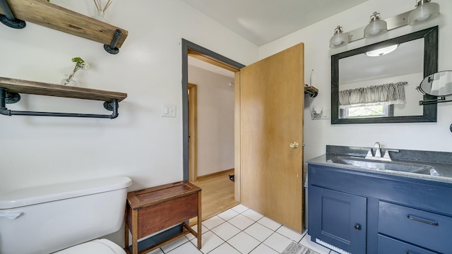 1008 Mary Ave, Dixon, IL 61021 - half bathroom featuring toilet, vanity, and tile patterned floors
