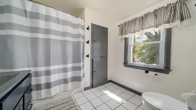 1008 Mary Ave, Dixon, IL 61021 - full bath with tile patterned floors, lofted ceiling, toilet, a shower with shower curtain, and vanity