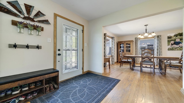 1008 Mary Ave, Dixon, IL 61021 - foyer entrance with hardwood / wood-style flooring, a chandelier, and baseboards