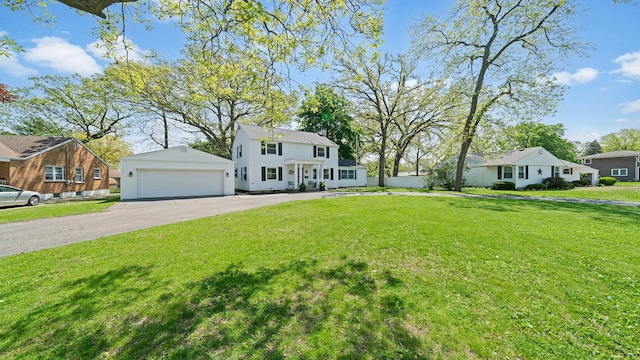 1008 Mary Ave, Dixon, IL 61021 - view of front facade featuring a front lawn, a chimney, a residential view, and a detached garage