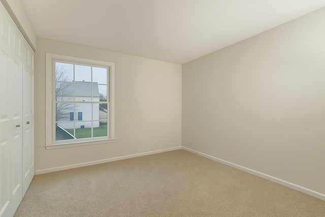 3615 Fairfax Ct E, Aurora, IL 60504 - spare room with light colored carpet and baseboards