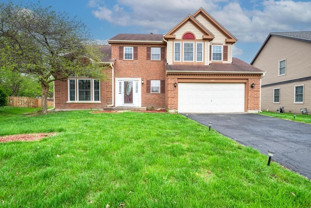3615 Fairfax Ct E, Aurora, IL 60504 - view of front facade featuring asphalt driveway, brick siding, and a garage