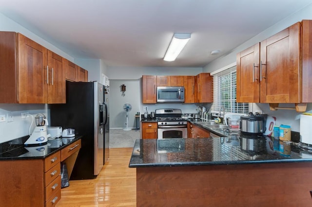 3615 Fairfax Ct E, Aurora, IL 60504 - kitchen with stainless steel appliances, light wood-style flooring, a peninsula, a sink, and brown cabinets