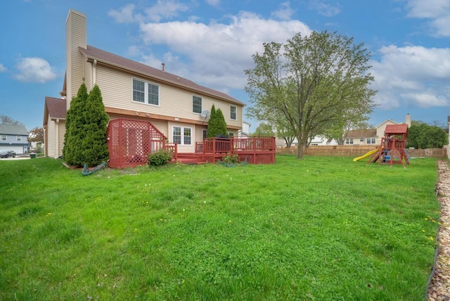3615 Fairfax Ct E, Aurora, IL 60504 - view of yard with a deck and a playground