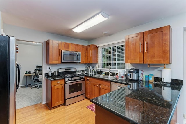 3615 Fairfax Ct E, Aurora, IL 60504 - kitchen featuring stainless steel appliances, a sink, brown cabinets, and light wood finished floors