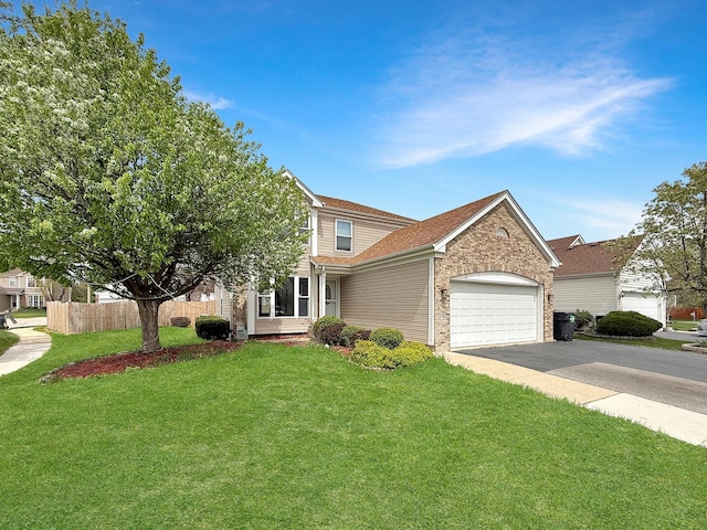 view of front of property featuring an attached garage, a front lawn, aphalt driveway, and fence