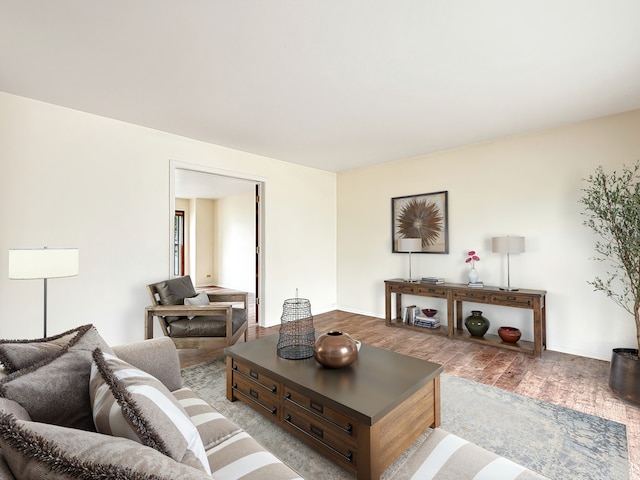 living room with baseboards and wood finished floors