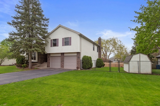 759 Dunmore Ln, Bartlett, IL 60103 - view of front facade with a front lawn, driveway, and fence