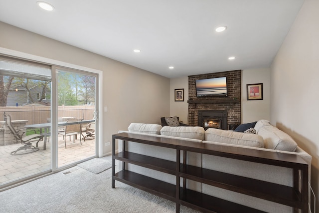 759 Dunmore Ln, Bartlett, IL 60103 - carpeted living area featuring visible vents, a brick fireplace, and recessed lighting