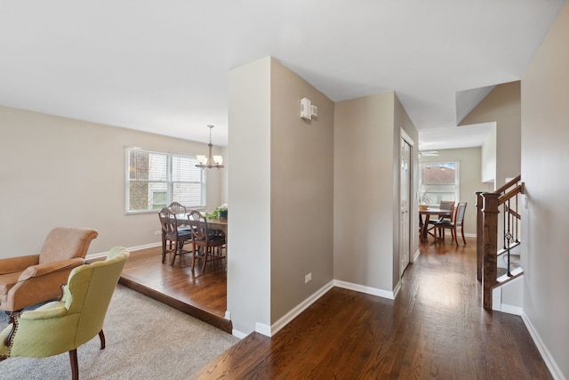 759 Dunmore Ln, Bartlett, IL 60103 - hall featuring an inviting chandelier, baseboards, and dark wood-type flooring