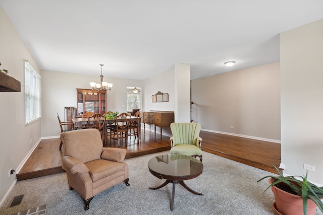 759 Dunmore Ln, Bartlett, IL 60103 - living area featuring baseboards, a chandelier, visible vents, and wood finished floors