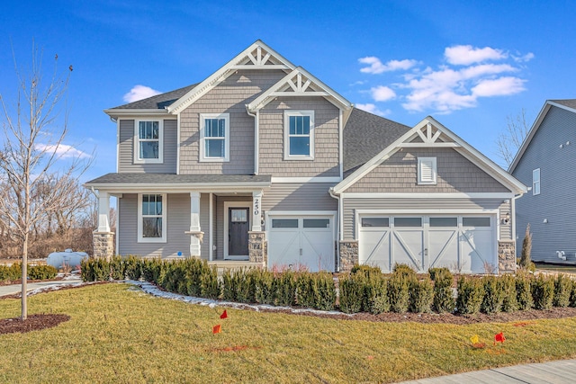 craftsman inspired home featuring covered porch, stone siding, and a front lawn