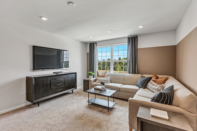 living area with light colored carpet, recessed lighting, and baseboards