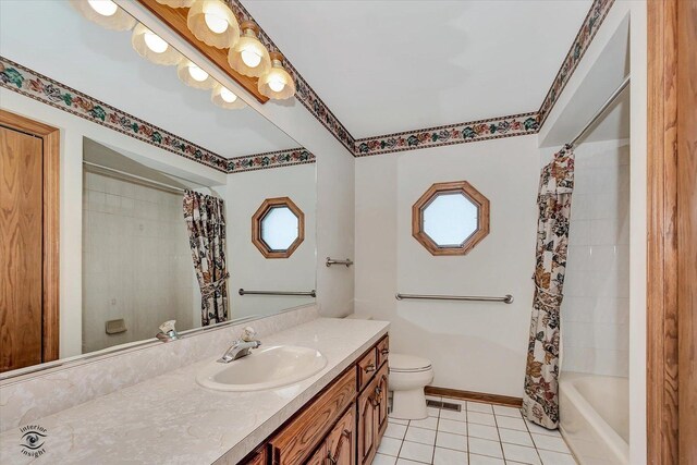 19640 Patricia Ln, Mokena, IL 60448 - full bath with toilet, tile patterned floors, vanity, baseboards, and shower / bathtub combination with curtain