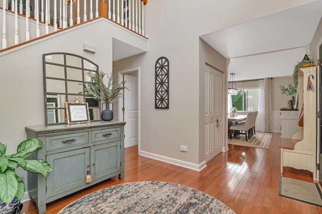 foyer featuring baseboards and light wood-style flooring