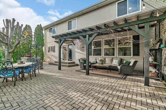 view of patio featuring outdoor lounge area, a pergola, and outdoor dining space