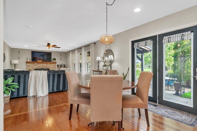 dining space featuring a ceiling fan, plenty of natural light, and hardwood / wood-style floors