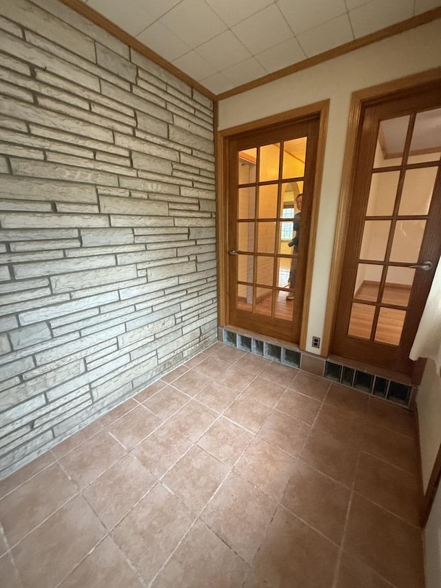 doorway featuring crown molding and visible vents