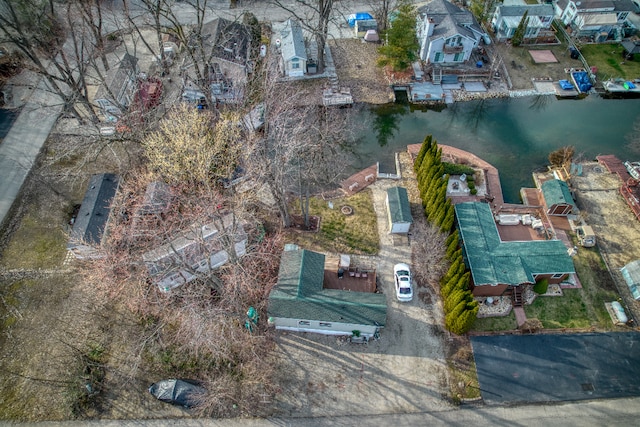 aerial overview of property's location with a large body of water and nearby suburban area