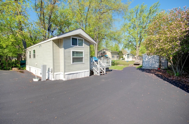 view of side of property featuring a deck