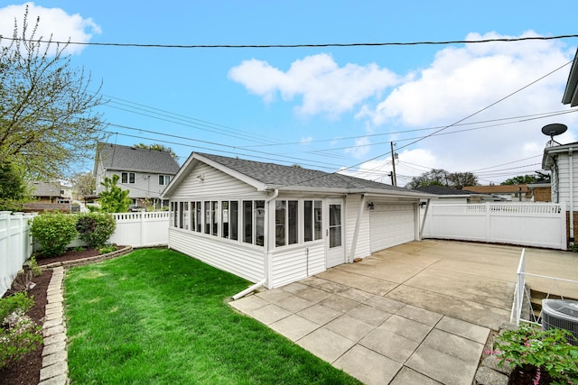 view of home's exterior with fence and a sunroom