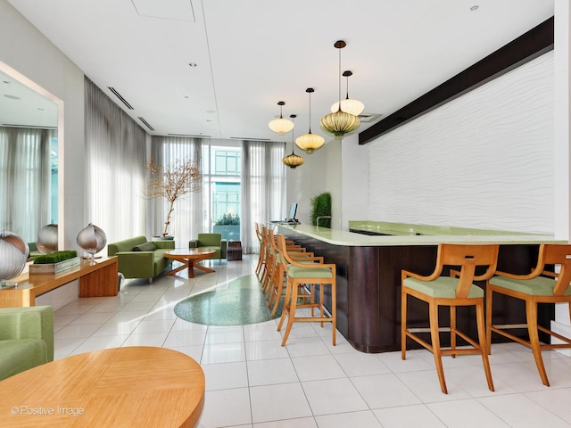 123 S Green St Unit 710B, Chicago, IL 60607 - bar featuring expansive windows, light tile patterned floors, and hanging light fixtures