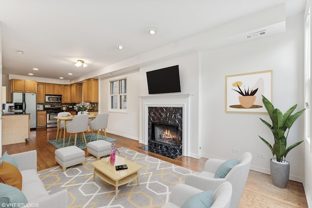 1825 W Iowa St Unit 2, Chicago, IL 60622 - living room featuring recessed lighting, wood finished floors, a high end fireplace, and baseboards