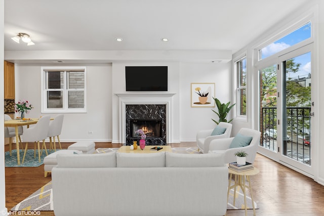 1825 W Iowa St Unit 2, Chicago, IL 60622 - living room featuring a high end fireplace, recessed lighting, wood finished floors, and baseboards