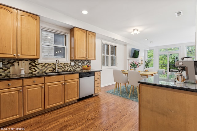 1825 W Iowa St Unit 2, Chicago, IL 60622 - kitchen featuring dishwasher, a sink, wood finished floors, decorative backsplash, and dark stone countertops