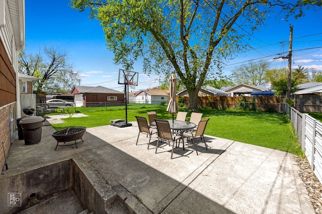 4704 W 99th St, Oak Lawn, IL 60453 - fenced backyard featuring a fire pit, a patio area, outdoor dining space, and a residential view