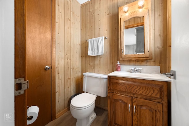 4704 W 99th St, Oak Lawn, IL 60453 - bathroom featuring vanity, wood walls, and wood finished floors