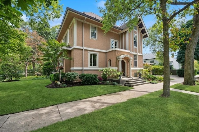 1335 Asbury Ave, Evanston, IL 60201 - tudor home with stucco siding and a front yard