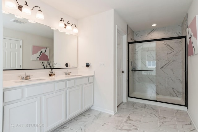 full bath featuring baseboards, marble finish flooring, a shower stall, double vanity, and recessed lighting