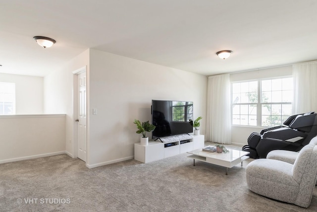 living room with carpet and baseboards