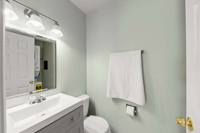 bathroom featuring toilet and vanity