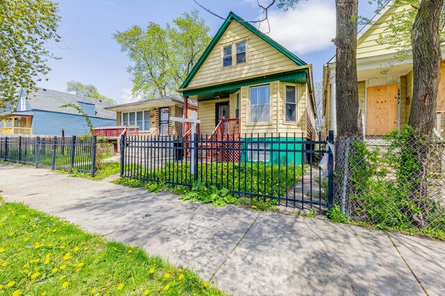 6835 S Winchester Ave, Chicago, IL 60636 - bungalow-style house with a fenced front yard and a porch