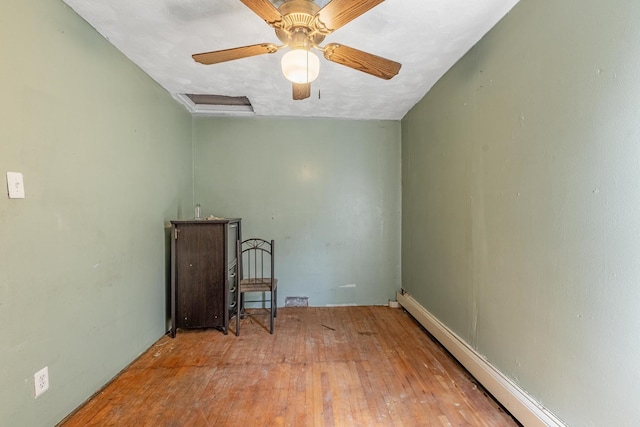 6835 S Winchester Ave, Chicago, IL 60636 - empty room featuring wood-type flooring, a ceiling fan, and baseboard heating