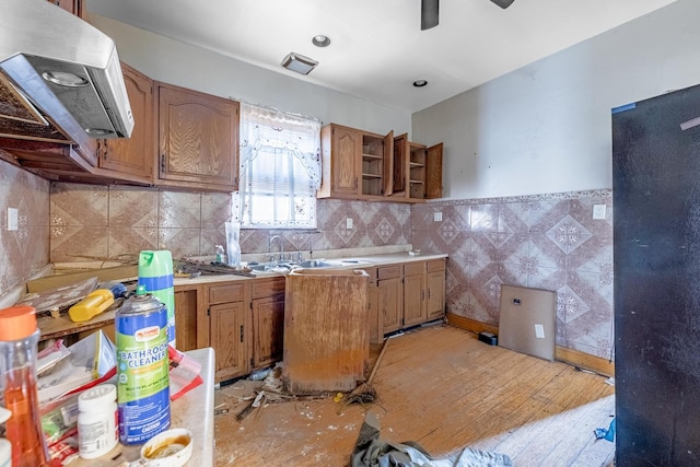 6835 S Winchester Ave, Chicago, IL 60636 - kitchen featuring brown cabinetry, open shelves, light countertops, a sink, and exhaust hood
