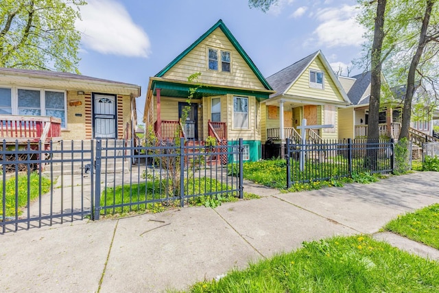 6835 S Winchester Ave, Chicago, IL 60636 - bungalow-style home with a porch, a gate, and a fenced front yard