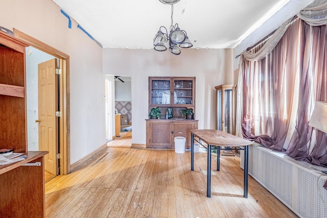 6835 S Winchester Ave, Chicago, IL 60636 - office with light wood-style floors, radiator, and a chandelier