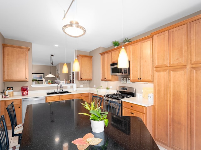 kitchen with pendant lighting, appliances with stainless steel finishes, a sink, light brown cabinets, and recessed lighting