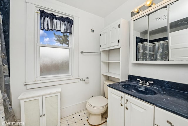 full bath featuring toilet, baseboards, curtained shower, tile patterned floors, and vanity