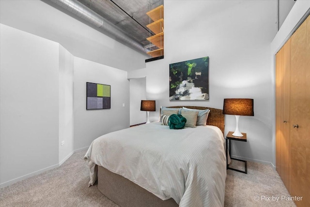 carpeted bedroom with baseboards
