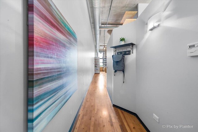 corridor with wood finished floors