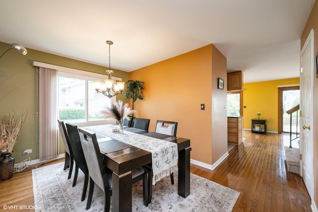 1141 E Randville Dr, Palatine, IL 60074 - dining space featuring light wood finished floors, baseboards, and an inviting chandelier